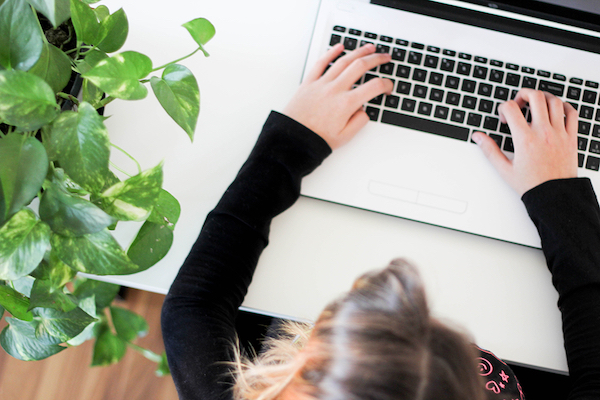 Woman starting a nonprofit by filing a document on her computer