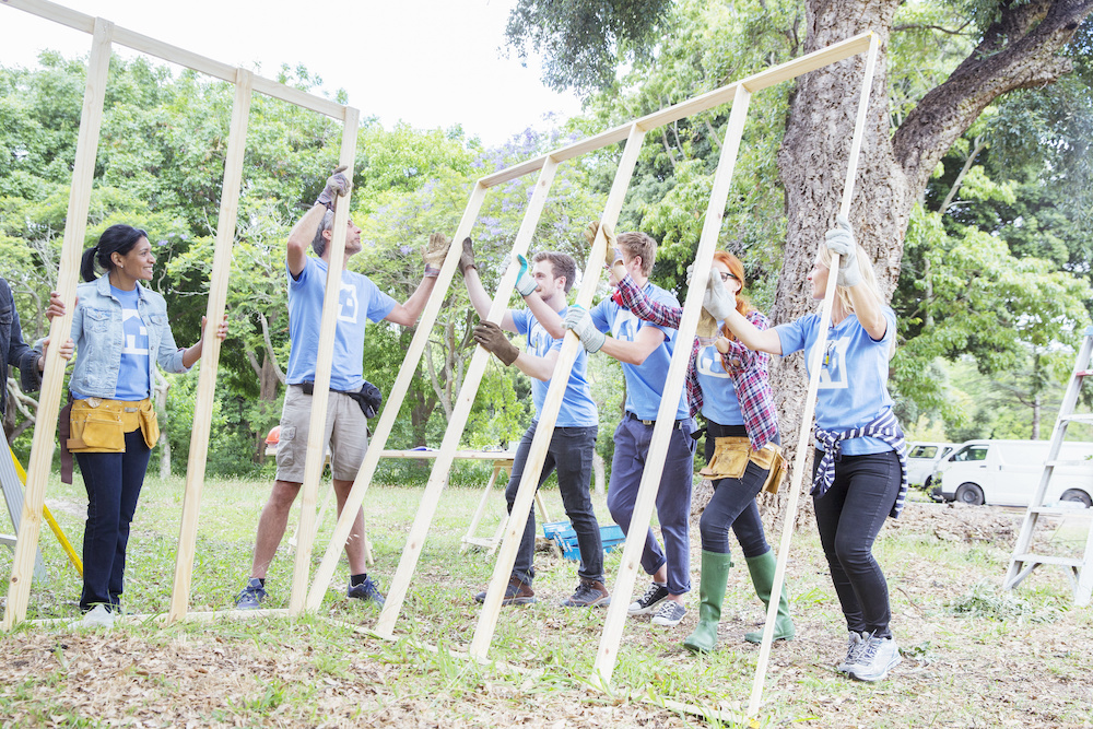 Volunteers of a nonprofit building a house.