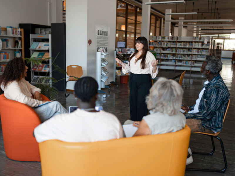 A nonprofit leader training her staff in order to reduce nonprofit liability and risk.