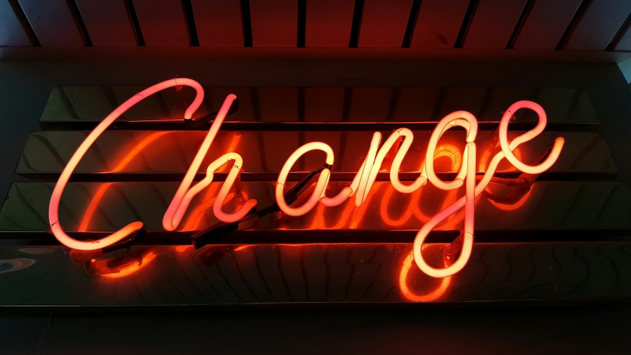 A red neon sign that says "change"
